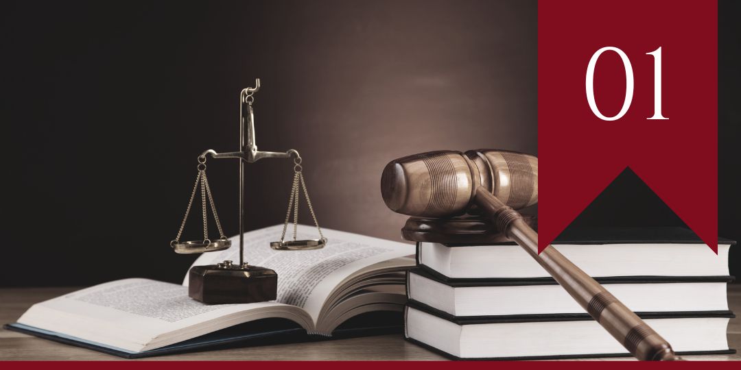 Episode 01 a desk at a law office with a wooden gravel and law books on top. 