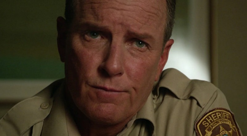 sherrif Sherrif Stilinski - an mature white man in a a Sherrif's uniform.